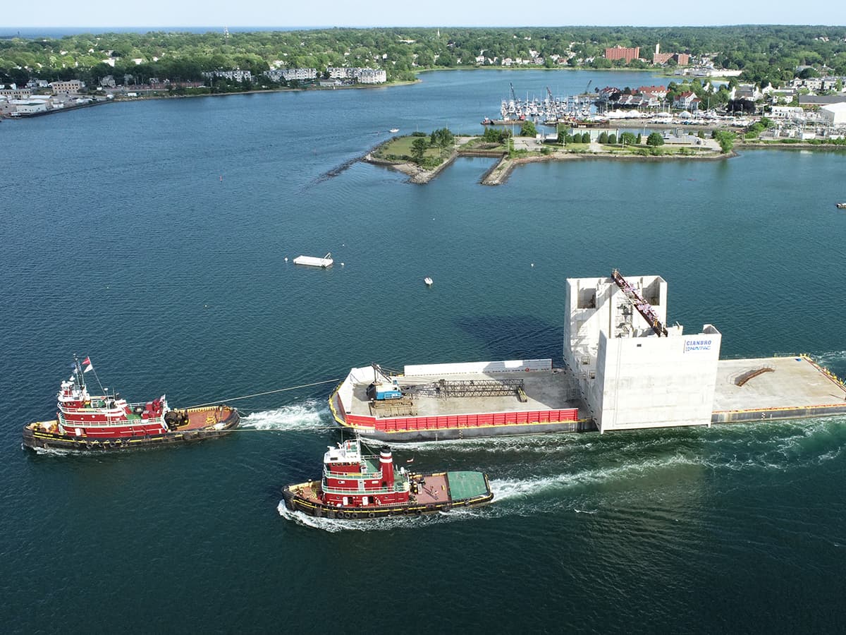 The Rowan McAllister, with the Resolute off her port side, shows McAllister's ability to tow large barges and structures.